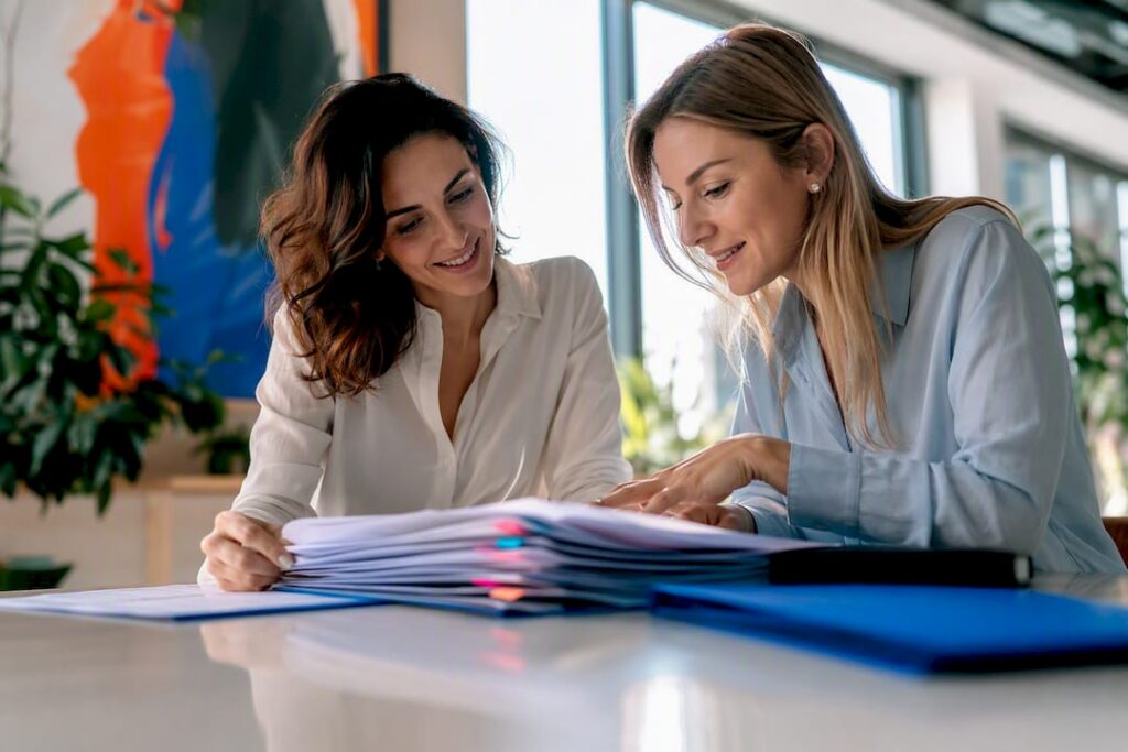 Medical linguists reviewing regulatory translation pages